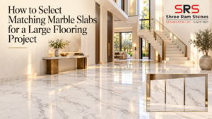 Matching marble slabs arranged across a large white marble floor